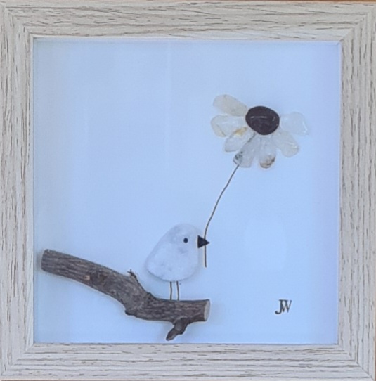 Blume im Schnabel rechts